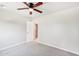 Bedroom with plush carpet, a ceiling fan, and an adjoining door to other rooms at 3043 E Hartford Ave, Phoenix, AZ 85032