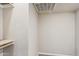 Walk in closet with carpeted floors and wood rails at 3043 E Hartford Ave, Phoenix, AZ 85032
