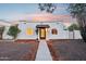 Charming single-story home with stucco exterior, desert landscaping, and a welcoming entrance at 3043 E Hartford Ave, Phoenix, AZ 85032