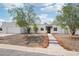 Inviting single-story home with a well-maintained lawn, desert landscaping, and a welcoming entrance at 3043 E Hartford Ave, Phoenix, AZ 85032
