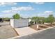 A modern home with clean lines, desert landscaping, and a spacious driveway, ready for its new owners at 3043 E Hartford Ave, Phoenix, AZ 85032