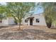 Charming home facade featuring desert landscaping, walkway, and a covered entrance for a classic look at 3043 E Hartford Ave, Phoenix, AZ 85032