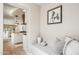 Hallway leading to a kitchen with a horse art piece and a seating bench at 3043 E Hartford Ave, Phoenix, AZ 85032