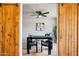 Home office behind sliding barn door, complete with desk, chairs, and decor at 3043 E Hartford Ave, Phoenix, AZ 85032