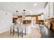 Spacious kitchen boasts center island with seating, stainless appliances, and wood backsplash at 3043 E Hartford Ave, Phoenix, AZ 85032