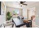 Office featuring a dark table with stylish decor, a large window and views to the outside at 3043 E Hartford Ave, Phoenix, AZ 85032