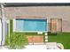 A top-down shot of the pool, framed with pavers, decorative pergola and lush turf landscaping at 3043 E Hartford Ave, Phoenix, AZ 85032