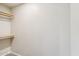 A walk-in closet equipped with shelving and ample storage space for organization at 3043 E Hartford Ave, Phoenix, AZ 85032