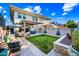 Spacious backyard with lawn, patio with seating and mature plants at 306 W Culver St, Phoenix, AZ 85003