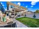 Enjoy the outdoors in this cozy backyard with a fire pit, dining set, and patio furniture at 306 W Culver St, Phoenix, AZ 85003