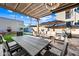 An outdoor patio features a dining set, lounge set, and a pergola for shaded enjoyment at 306 W Culver St, Phoenix, AZ 85003