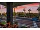 Balcony view showcases a cityscape with tall palm trees and a vibrant pink and orange sunset at 306 W Culver St, Phoenix, AZ 85003