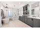 Luxurious bathroom with freestanding tub, glass shower, and double sink vanity at 306 W Culver St, Phoenix, AZ 85003