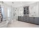 Elegant bathroom with freestanding tub, glass shower, and double sink vanity at 306 W Culver St, Phoenix, AZ 85003