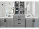 Bathroom featuring double vanity, white marble counters, and shaker cabinets at 306 W Culver St, Phoenix, AZ 85003