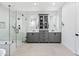 Bright bathroom features white tile walls, a glass shower, and a double sink vanity at 306 W Culver St, Phoenix, AZ 85003