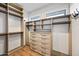 Bright walk-in closet with custom shelving and drawers for optimal organization and storage at 306 W Culver St, Phoenix, AZ 85003