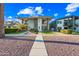 Charming two-story house with modern architecture, complemented by lush green lawn at 306 W Culver St, Phoenix, AZ 85003