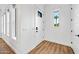 Hallway with white walls, wood floors, and plenty of natural light at 306 W Culver St, Phoenix, AZ 85003