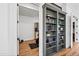 View of a home gym featuring a stationary bike and a custom built-in shelving at 306 W Culver St, Phoenix, AZ 85003