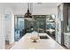 This kitchen features a kitchen island, stainless steel appliances, and sliding glass doors at 306 W Culver St, Phoenix, AZ 85003