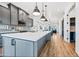 Spacious kitchen with a long island, stainless steel appliances, and gray cabinets at 306 W Culver St, Phoenix, AZ 85003