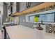 Close-up of kitchen showcasing elegant white countertops, patterned backsplash, and modern appliances at 306 W Culver St, Phoenix, AZ 85003