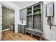 Mudroom featuring storage, bench, sink, and water heater at 306 W Culver St, Phoenix, AZ 85003