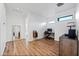 Bright office space features wood floors, modern desk, and plenty of natural light through the window at 306 W Culver St, Phoenix, AZ 85003