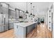 An open floor plan with a bright kitchen, dining area, and living room creates a welcoming and connected space at 306 W Culver St, Phoenix, AZ 85003