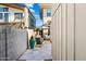 Private side yard patio area, featuring lounge seating and mature trees at 306 W Culver St, Phoenix, AZ 85003