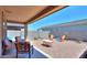 The backyard features patio space with seating as well as desert landscaping at 35175 W Marin Ave, Maricopa, AZ 85138