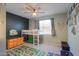 Well-lit bedroom featuring carpet, loft bed, and ceiling fan for optimal comfort at 35175 W Marin Ave, Maricopa, AZ 85138