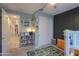 Bright bedroom featuring a loft bed, closet, carpet, and playful decor at 35175 W Marin Ave, Maricopa, AZ 85138