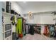 Spacious walk-in closet with ample shelving and hanging space for organized storage of clothes and accessories at 35175 W Marin Ave, Maricopa, AZ 85138