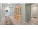 Inviting entryway with a decorative cabinet, tile flooring, and natural light at 35175 W Marin Ave, Maricopa, AZ 85138