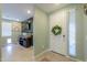 Open entryway leading into living space featuring a white front door and tile flooring at 35175 W Marin Ave, Maricopa, AZ 85138