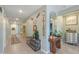 Bright and inviting entryway with decorative elements and ample natural light, and access to other rooms at 35175 W Marin Ave, Maricopa, AZ 85138