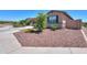 Well-maintained home featuring desert landscaping and a charming facade with stone accents at 35175 W Marin Ave, Maricopa, AZ 85138