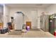 This garage is spacious enough to hold fridges, sporting equipment, and storage containers at 35175 W Marin Ave, Maricopa, AZ 85138