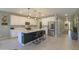 Bright kitchen with island, stainless appliances, white cabinets, and an open layout perfect for entertaining at 35175 W Marin Ave, Maricopa, AZ 85138