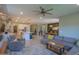 Open living space with eat-in kitchen, white cabinets, large island and access to the Gathering room at 35175 W Marin Ave, Maricopa, AZ 85138