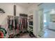 This walk-in closet has lots of clothing rack space and lots of cubbies for shoes and accessories at 35175 W Marin Ave, Maricopa, AZ 85138