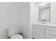 Powder bathroom featuring a clean, modern design with a white vanity and toilet at 4077 S Sabrina Dr # 30, Chandler, AZ 85248