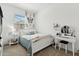 Well-lit bedroom with a white bed and a butterfly tapestry at 4077 S Sabrina Dr # 30, Chandler, AZ 85248