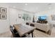 Well-lit open layout featuring a dining area with a natural wood table and easy access to the living room at 4077 S Sabrina Dr # 30, Chandler, AZ 85248