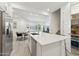 Open-concept kitchen with a quartz island, stainless steel appliances, and view to dining area and living room at 4077 S Sabrina Dr # 30, Chandler, AZ 85248