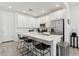 Bright kitchen featuring white cabinets, stainless steel appliances, and a large island with bar seating at 4077 S Sabrina Dr # 30, Chandler, AZ 85248