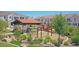 Community playground featuring swings, slides, and a covered picnic area amid lush landscaping at 4077 S Sabrina Dr # 30, Chandler, AZ 85248