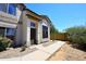 Charming home featuring tan stucco, neutral trim, and a welcoming entryway with mature landscaping at 4114 E Union Hills Dr # 1008, Phoenix, AZ 85050